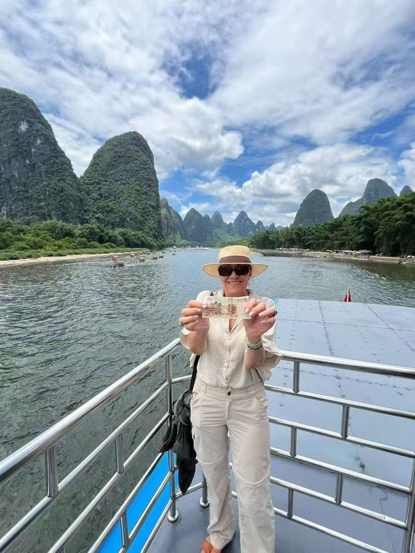 Guest on the Li River cruise deck